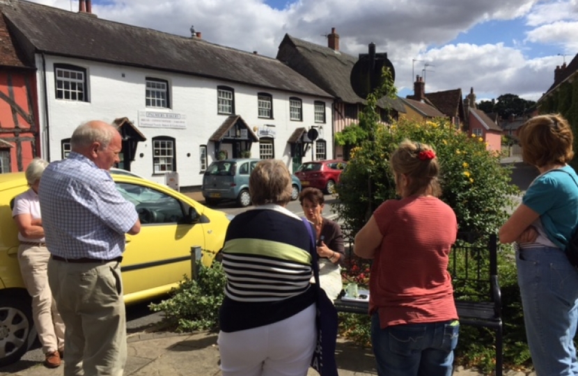 Jo Churchill MP speaking with residents in Woolpit