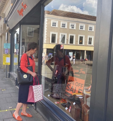 Jo looking in shop window